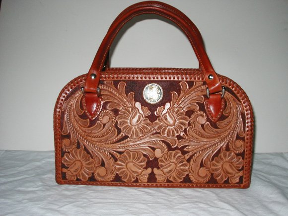 Floral carved purse